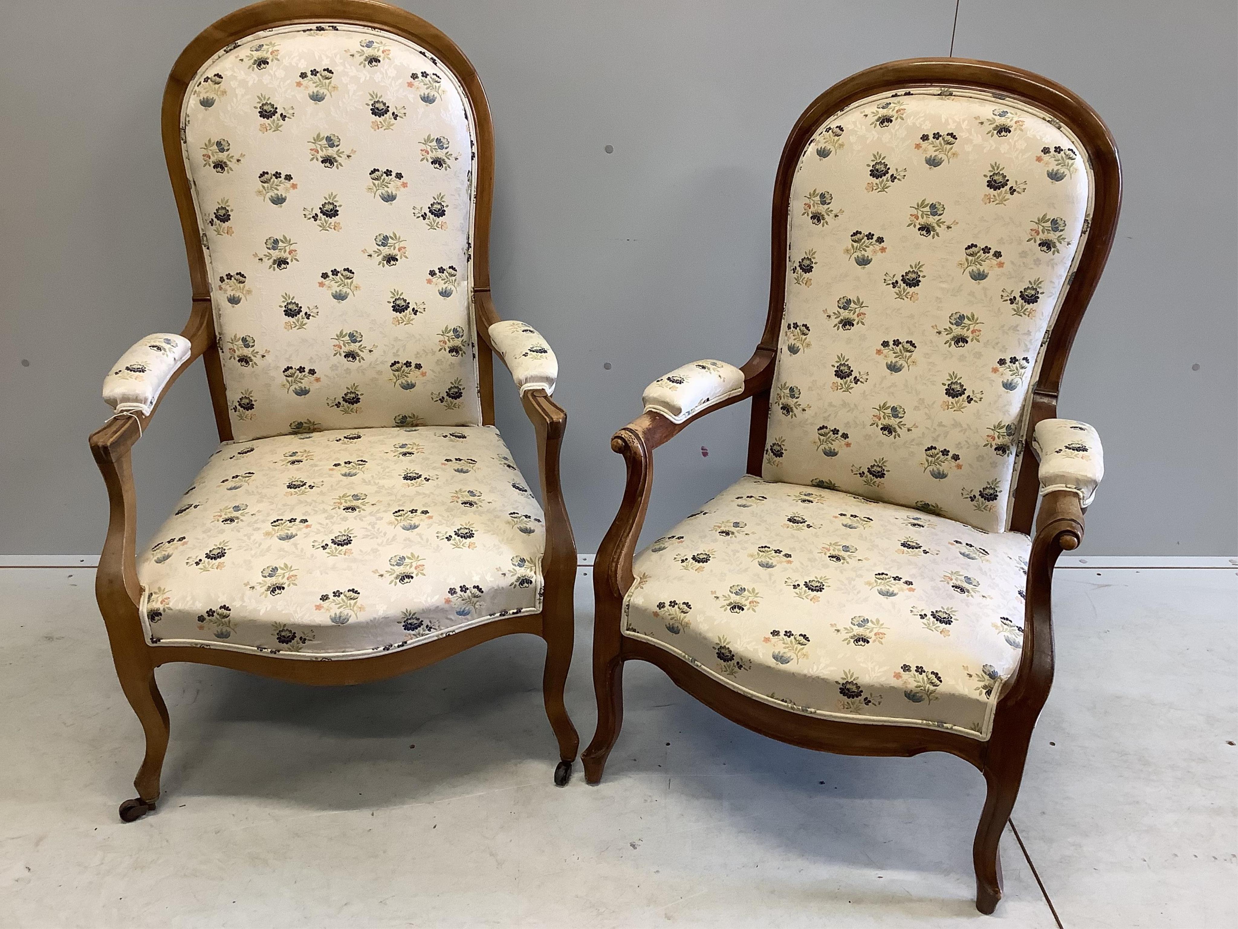 A near pair of Continental upholstered open armchairs, larger width 67cm, depth 58cm, height 114cm. Condition - fair